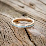 a wooden surface with a ring on it