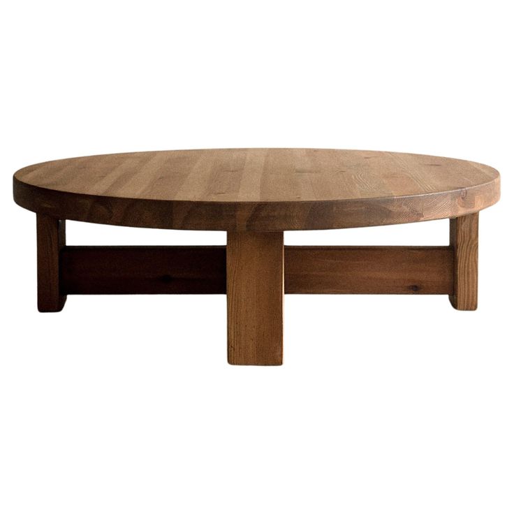 a round wooden table with two legs and a wood top on an isolated white background