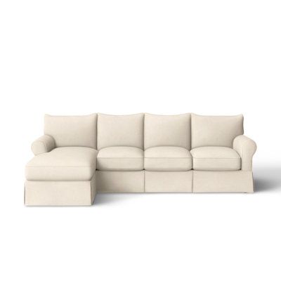 a white couch and ottoman sitting next to each other on a white background with no one in it