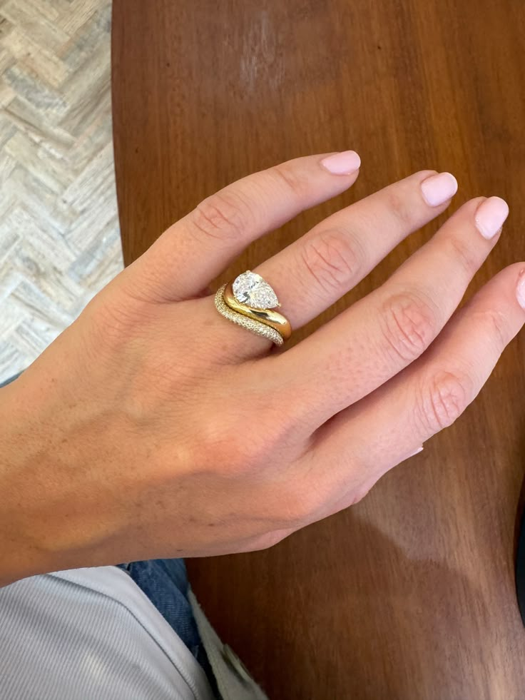 a woman's hand with a ring on it