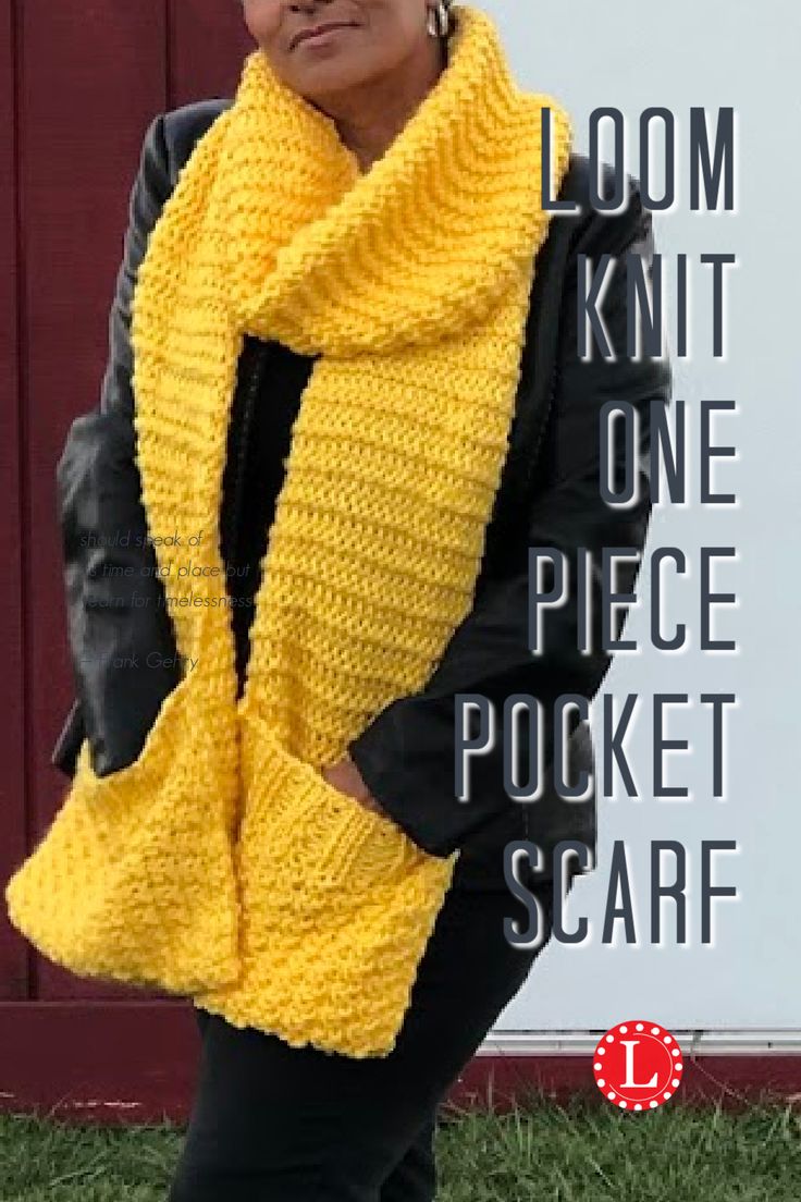 a woman standing in front of a sign wearing a yellow scarf