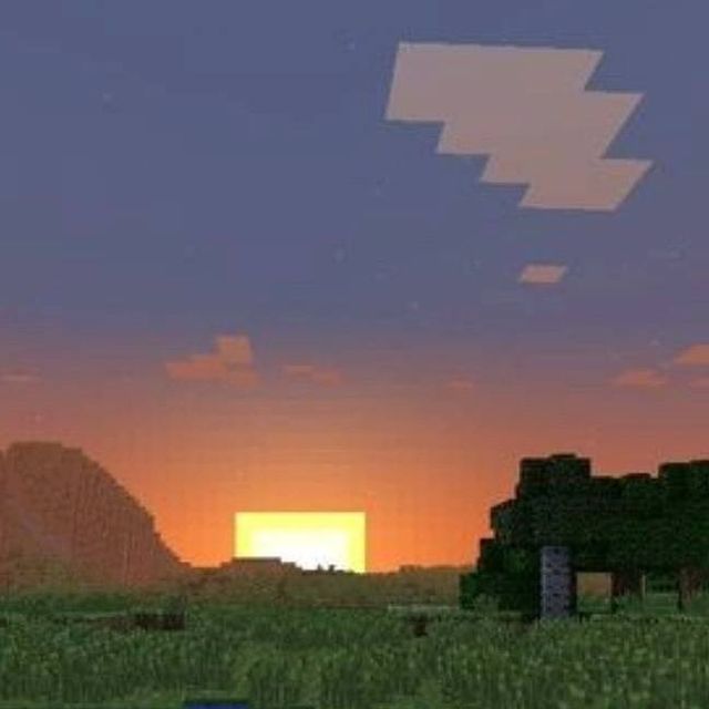 an image of a sunset in minecraft with the sun going down over some hills