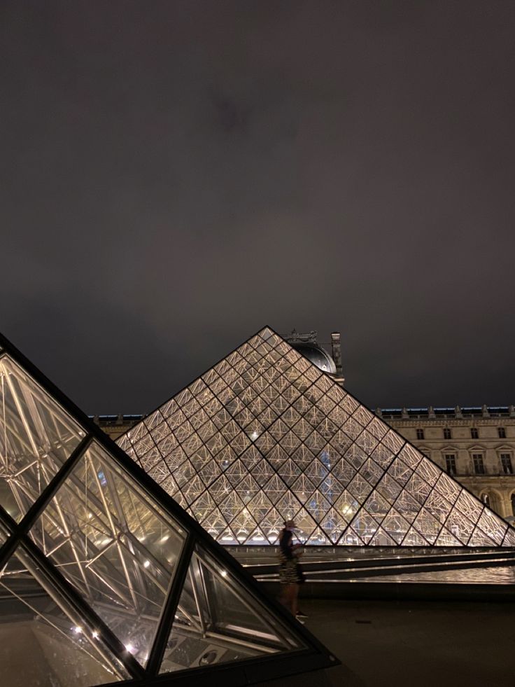 the glass pyramids are lit up at night