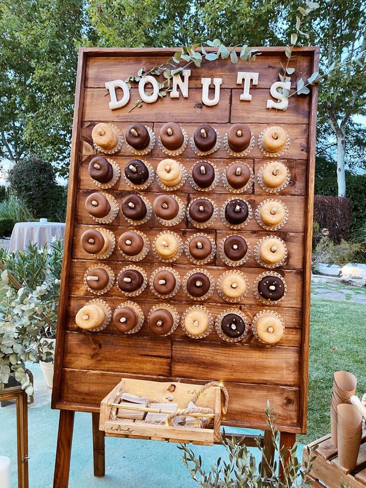 a donut shop sign with lots of doughnuts on it's display