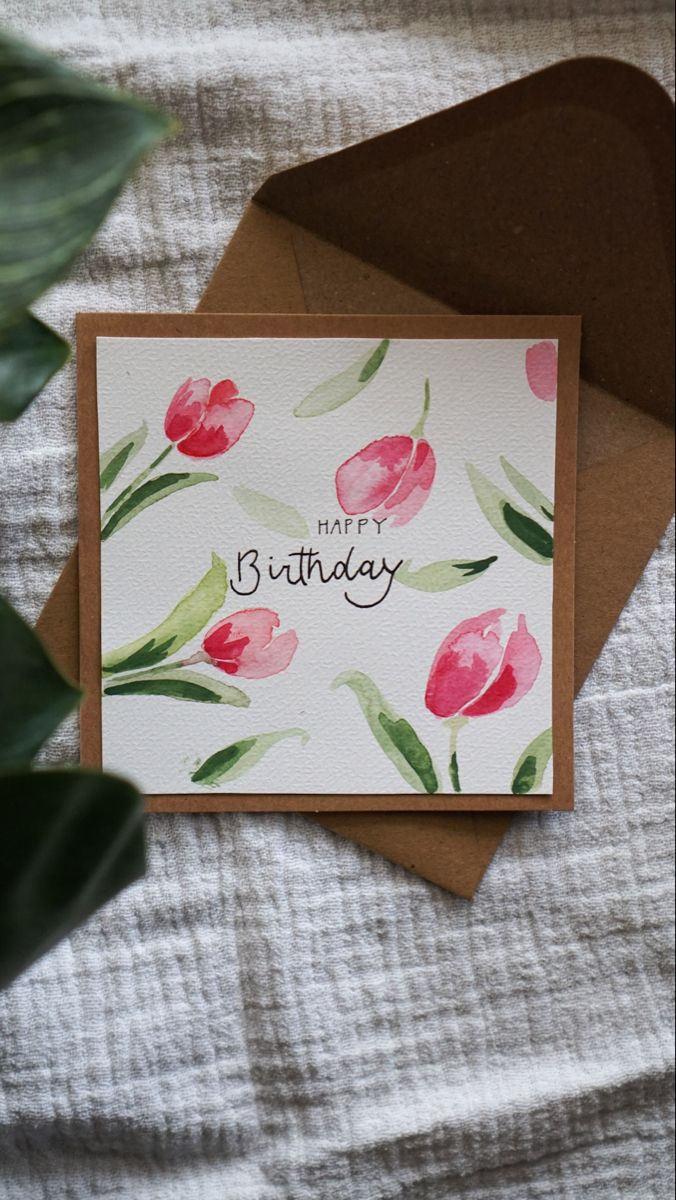 a birthday card with watercolor flowers on it