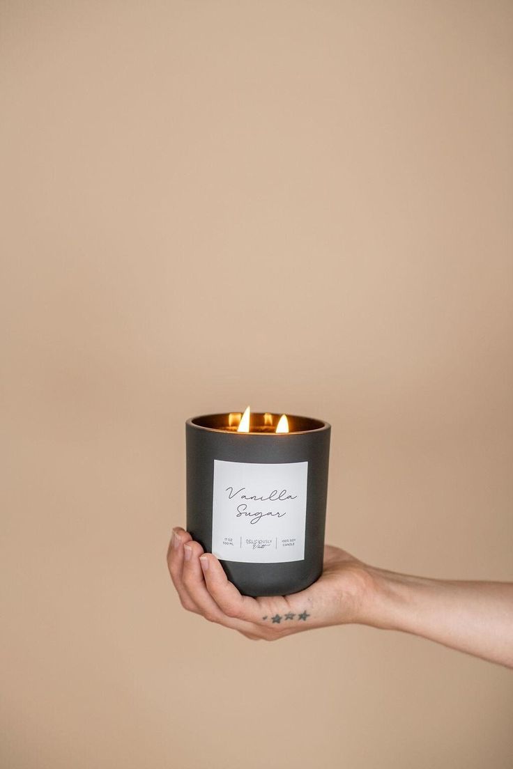 a person holding a candle in their hand that says, i am not sure if it is