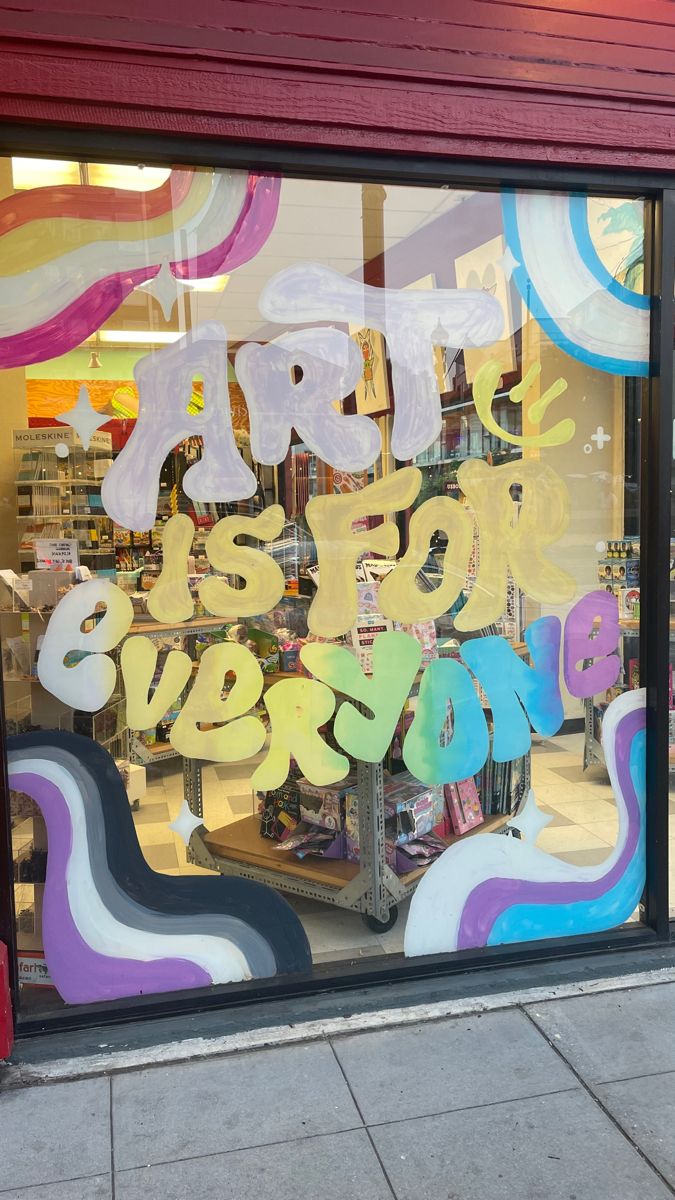 a store front window with the words happy new year painted on it