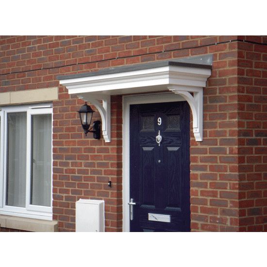 a black front door on a red brick house with white trim and window sill