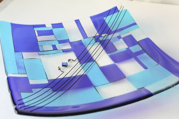 a blue and white plate sitting on top of a table