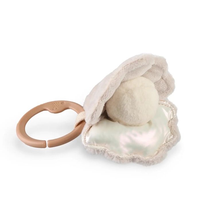 a stuffed animal with a ring in it's pouch