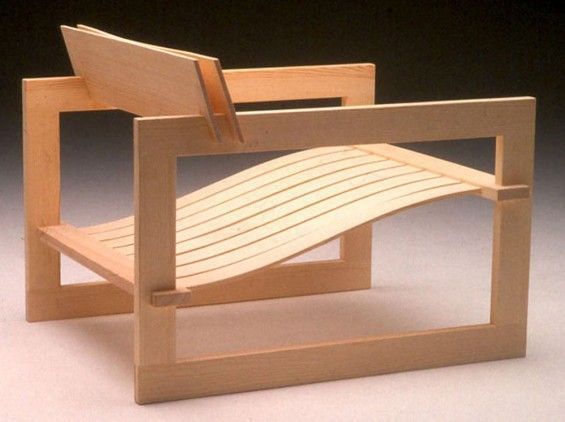 a miniature wooden chair made out of wood