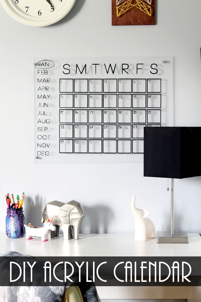 a desk with a calendar on the wall and a clock above it that says, diy acrylic calendar