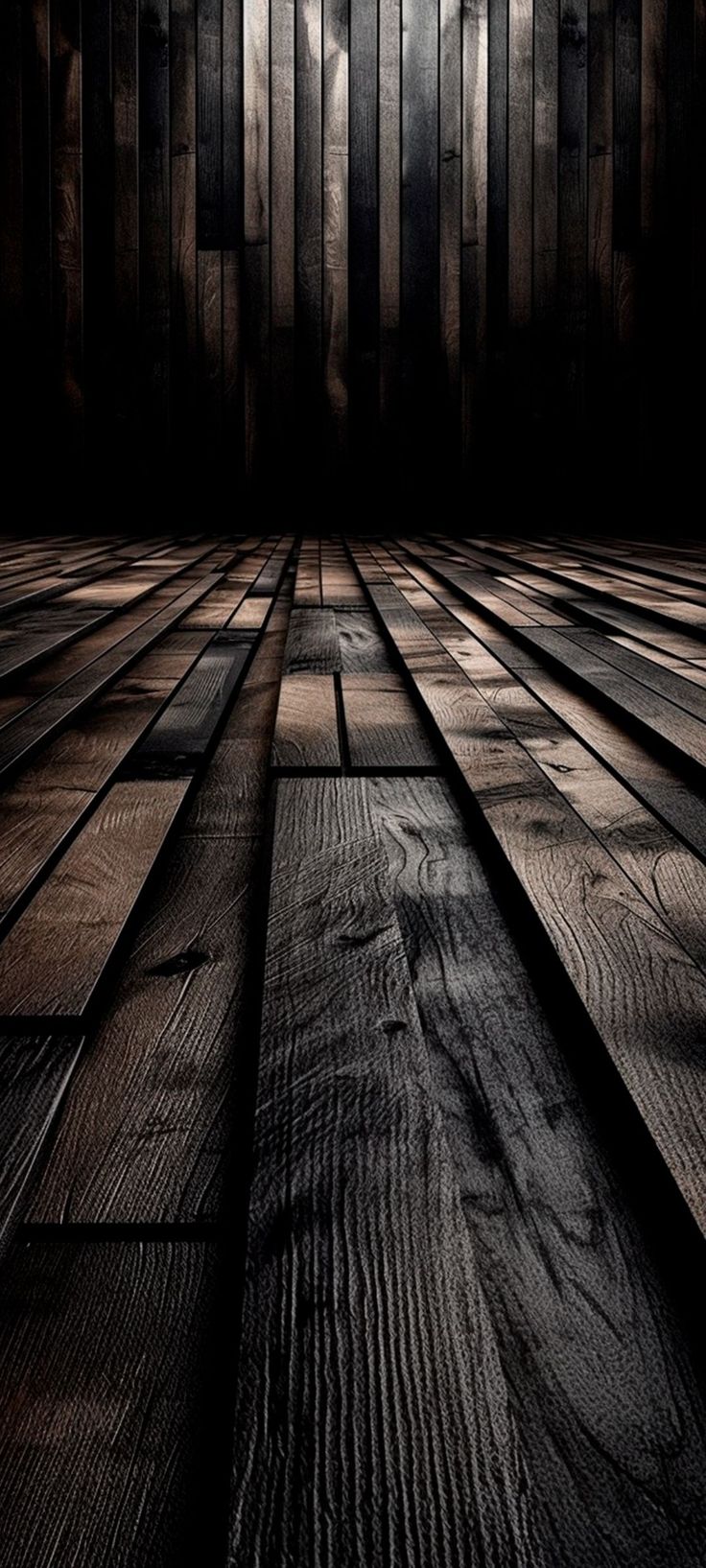 an empty room with wooden floors and dark lighting