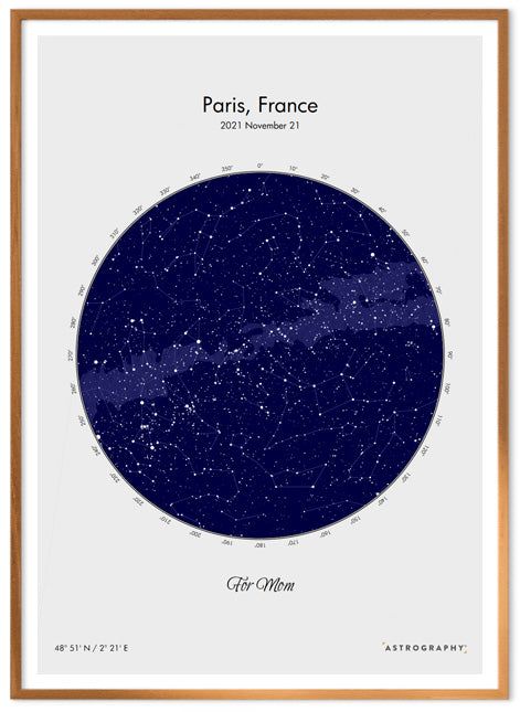 the map of paris, france in blue and gold framed on a white wall with wooden frame