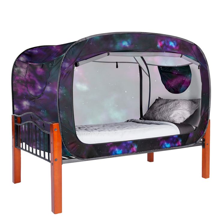 a bed with a purple and blue design on the side, it's made out of wood