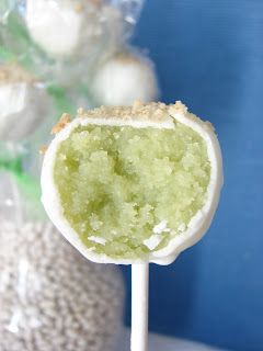 a green and white lollipop sitting on top of a table