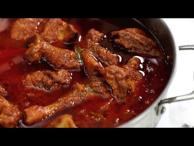 meat is being cooked in a pan on the stove