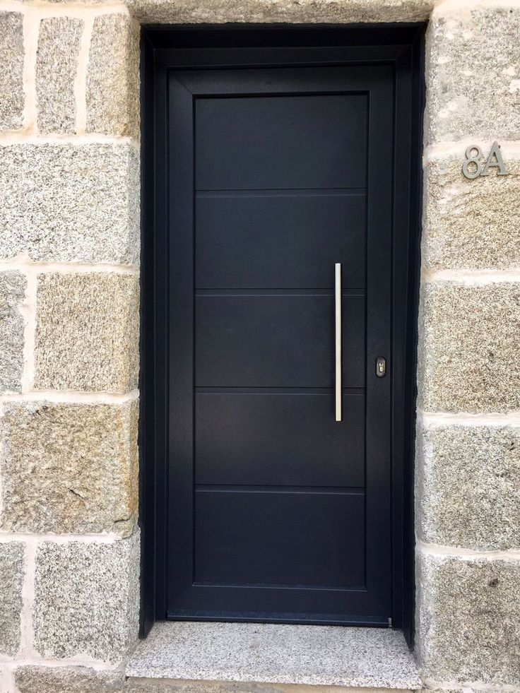 a black door with a metal handle on it