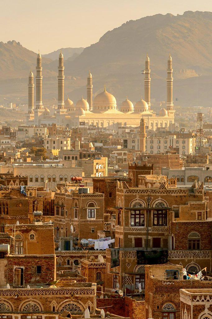 the city is surrounded by mountains and buildings