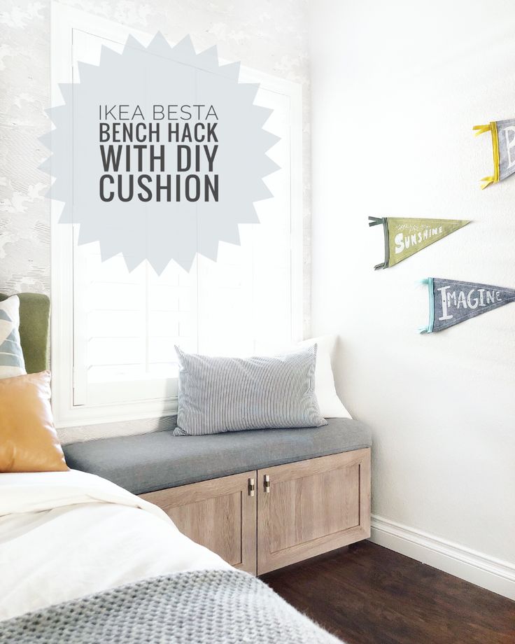 a bed room with a neatly made bed next to a window and some signs on the wall