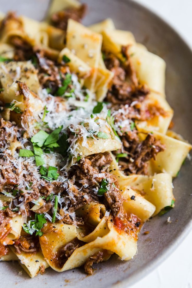 a pasta dish with meat and parmesan cheese