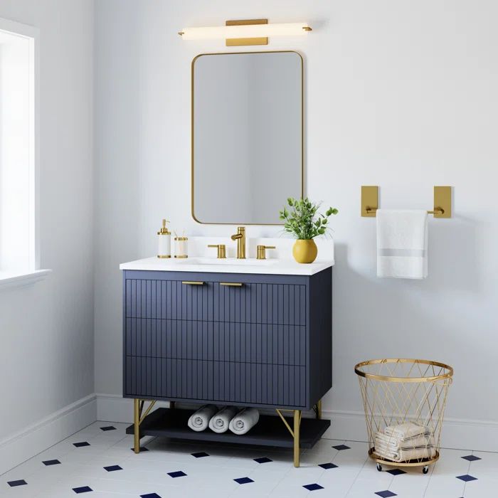 a bathroom with a sink, mirror and towel rack