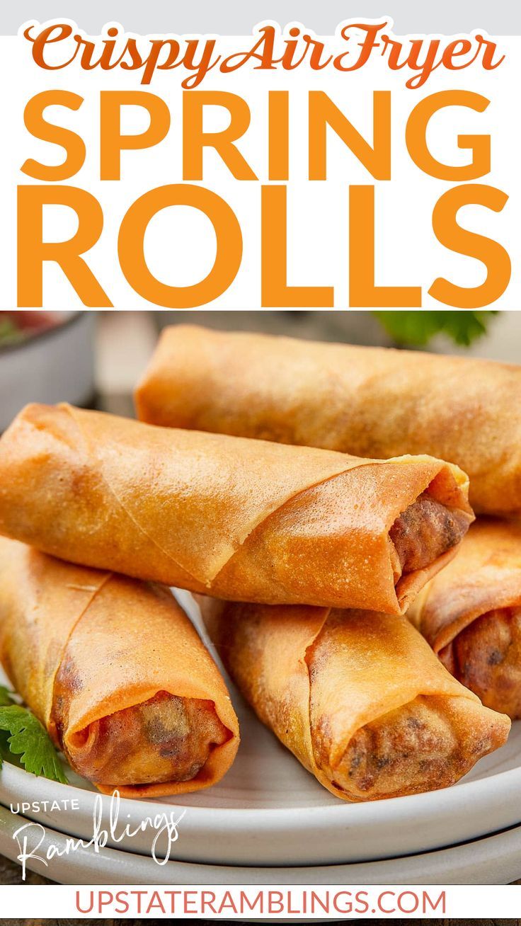 three spring rolls on a plate with lettuce and meat in the middle, text reads crispy air fryer spring rolls