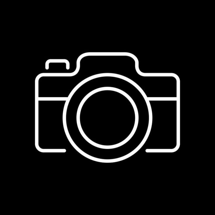 a black and white photo camera icon on a dark background with space for your text