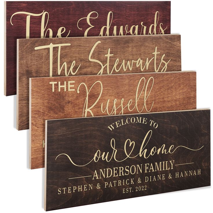 three wooden signs that say the names of each family and one is engraved on them