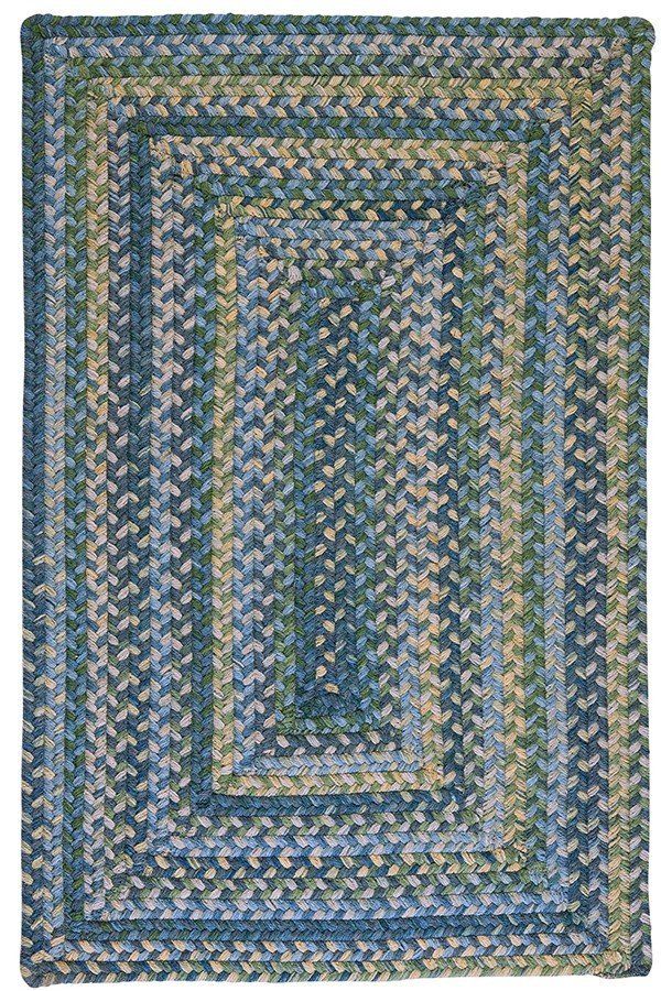 a blue and green braided rug on a white background