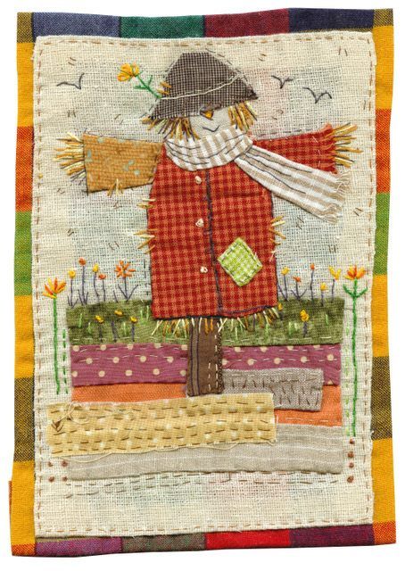 a patchwork quilt with a scarecrow on it