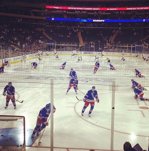 the hockey players are playing on the ice