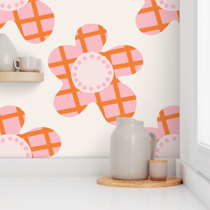 the wallpaper in this kitchen is painted with pink and orange plaid flowers on it