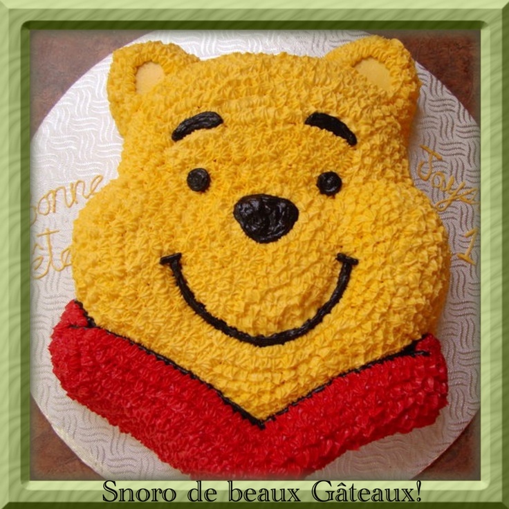 a winnie the pooh cake on a plate