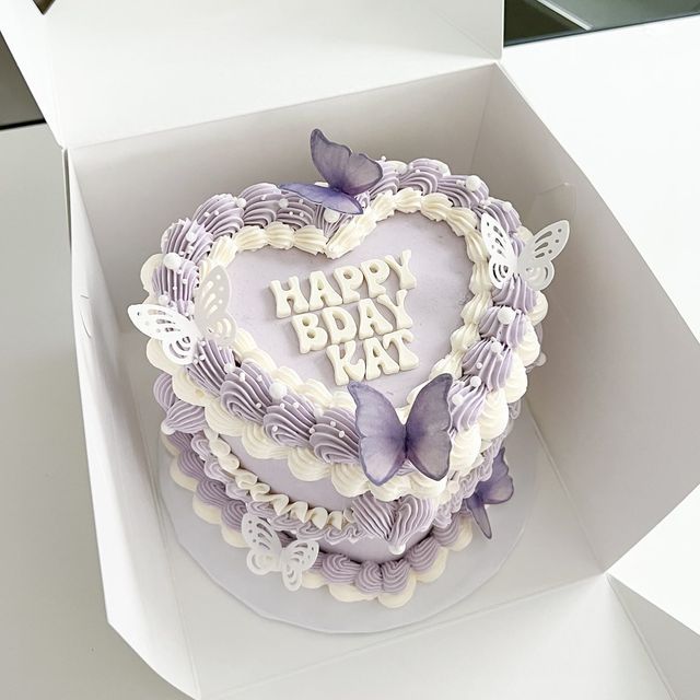 a heart shaped birthday cake in a box