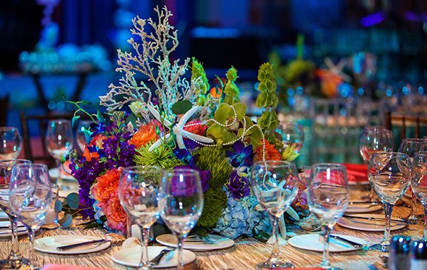 the table is set with many glasses and place settings