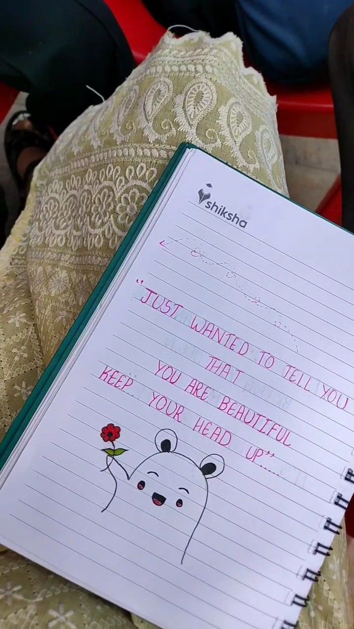 a notepad with an image of a polar bear on it next to a red chair