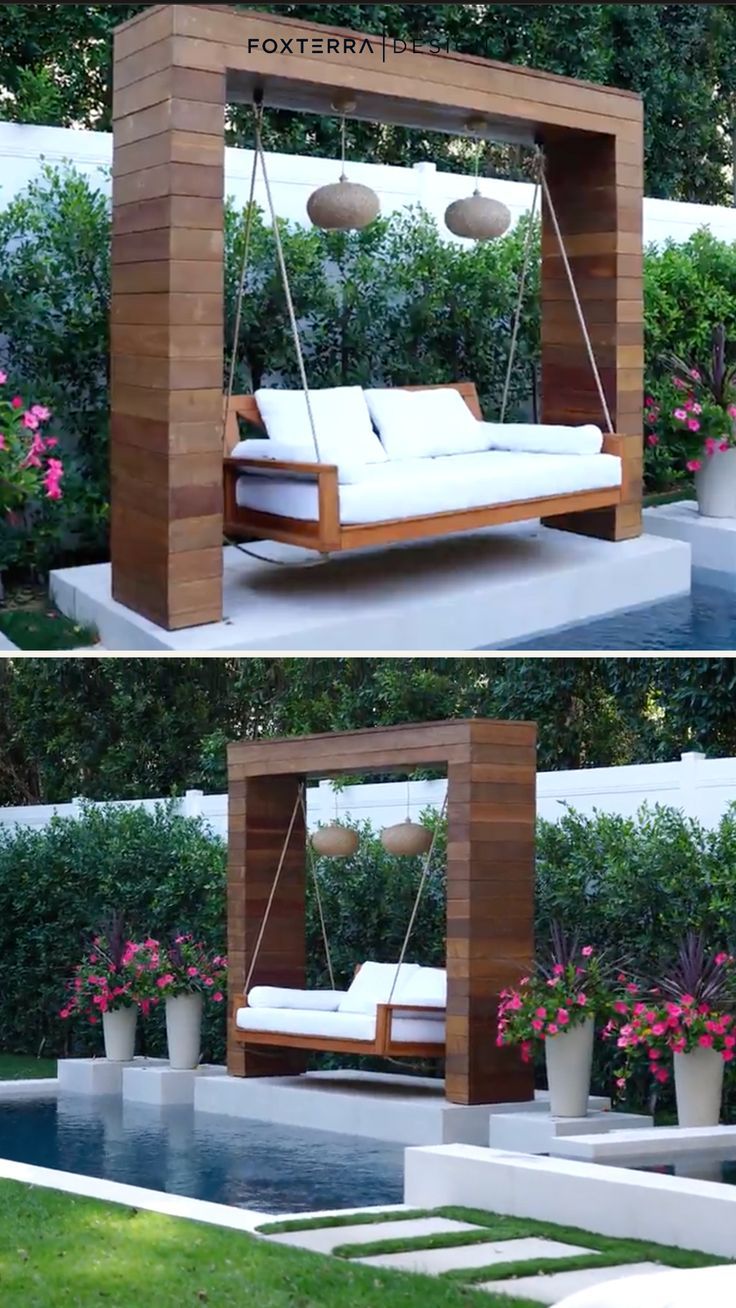 an outdoor swing bed in the shape of a house with flowers and plants around it