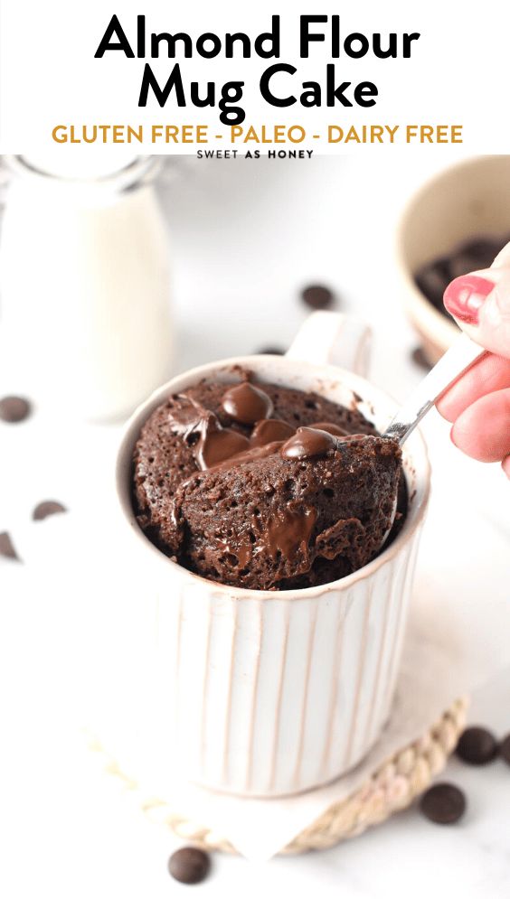 a person is spooning chocolate cake into a white bowl with milk and chocolate chips on the side