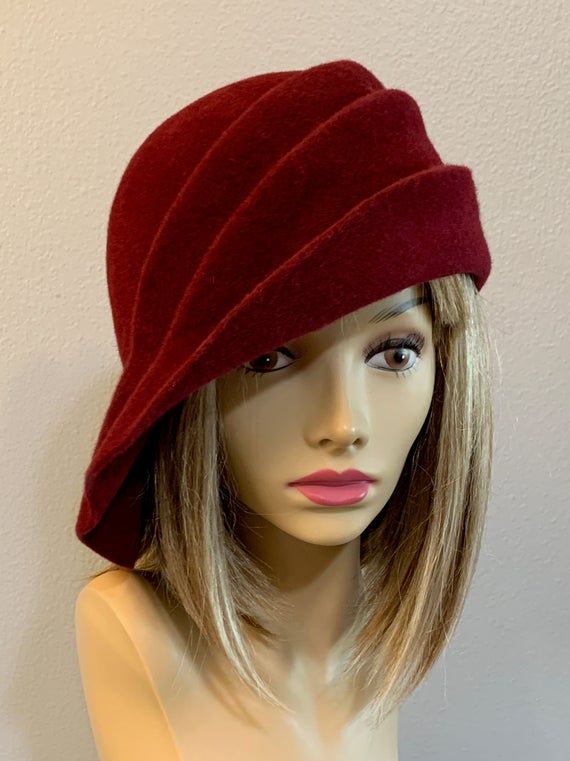 This beautiful ladies cloche is made from velour fur felt, and hand draped over an antique hat block. Hand finished with authentic millinery techniques. Please indicate your head size measurement when ordering (measure your head horizontally just above your eyebrows). When you receive your hat, Luxury Handmade Felt Hat With Flat Crown, Wool Cloche Hat With Curved Brim For Evening, Evening Wool Cloche Hat With Curved Brim, Retro Cloche Felt Hat For Winter, Adjustable Felt Cloche Hat, Elegant Felt Cloche Hat, Vintage Wool Cloche Hat, Vintage Felt Cloche Hat, Cappello Cloche