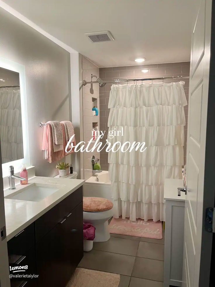 a bathroom with a shower, toilet and sink