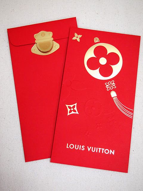 two red envelopes with a teddy bear on one and louis vuitton on the other