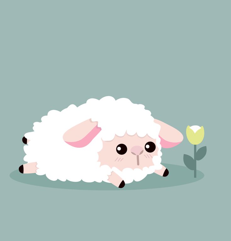 a sheep laying on the ground next to a flower