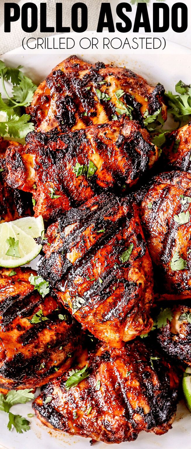 grilled chicken on a white plate with limes and cilantro