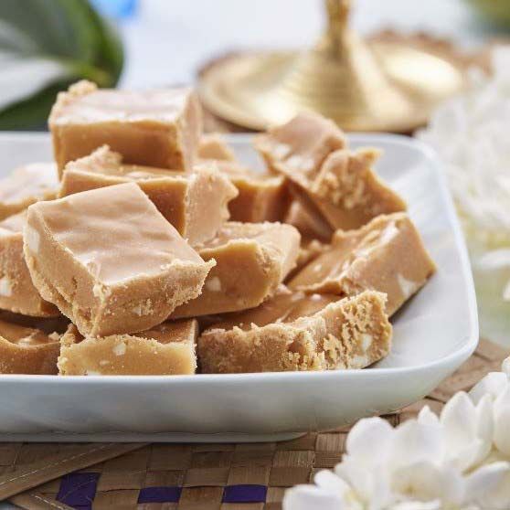 a white plate topped with pieces of peanut butter fudge