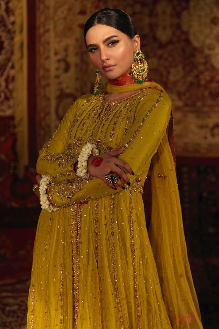 Tabassum – Zaaviay Yellow Raw Silk Dress For Reception, Gold Anarkali Set For Eid, Embellished Yellow Sharara For Eid, Yellow Embellished Anarkali Set With Traditional Drape, Gold Dupatta For Reception And Festivals, Gold Embroidered Sharara For Festivals, Gold Sharara With Gold Embroidery For Festivals, Festival Gold Sharara With Gold Embroidery, Yellow Raw Silk Dress For Wedding