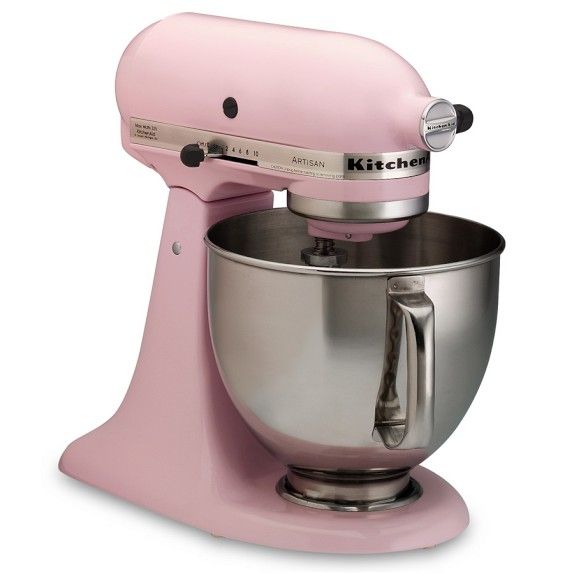 a pink stand mixer on a white background