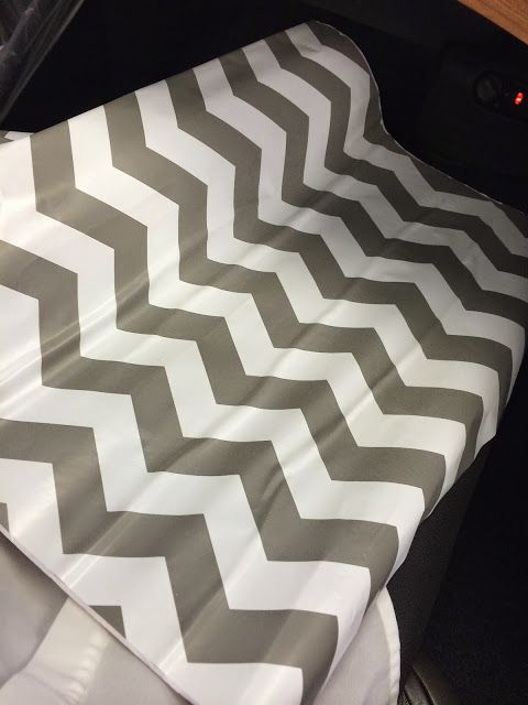 a car seat cover with a chevron pattern on it