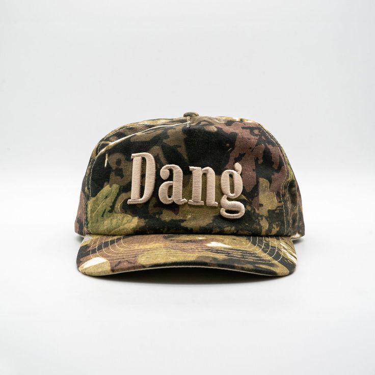 The original Dang Hat. Inspired by the 1 of 1 Chore Set our friend and local Austin artist, Erik Ross, created. Camo Hat Outfit, City Slickers, Camo Hats, Fall 24, Americana Fashion, Fitted Hats, Trucker Hats, Cotton Twill, Just In Case