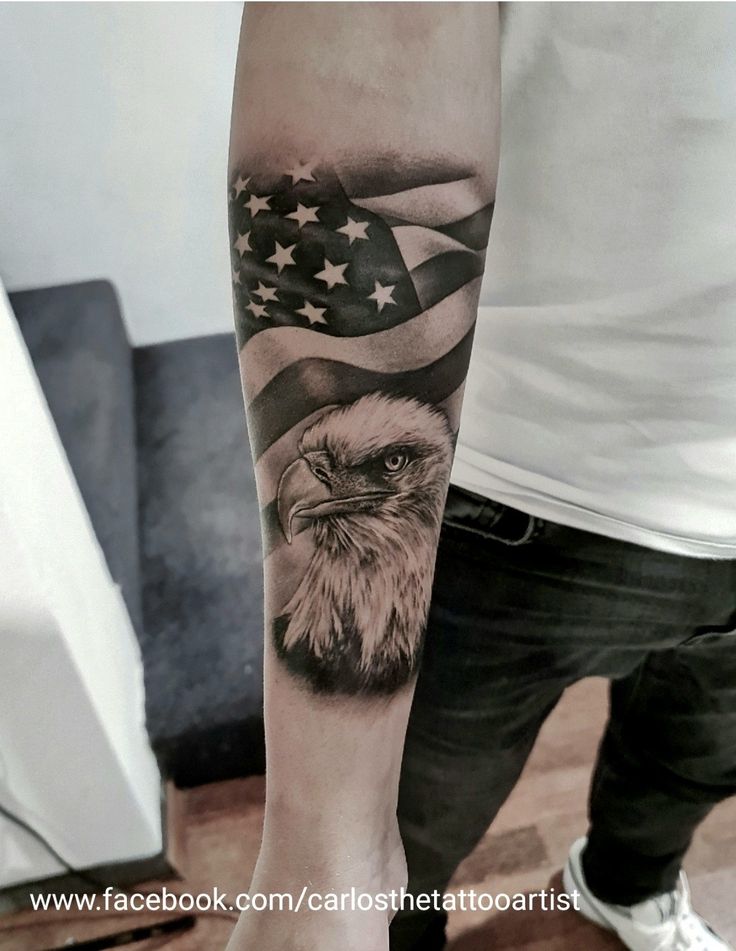 an eagle and american flag tattoo on the arm